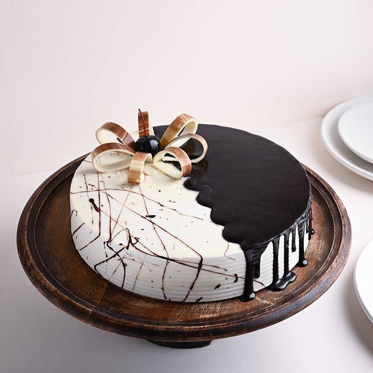 Elegant red velvet anniversary cake with gold accents
